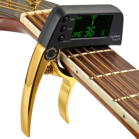 2-i-1 kapod och stämmare för gitarr